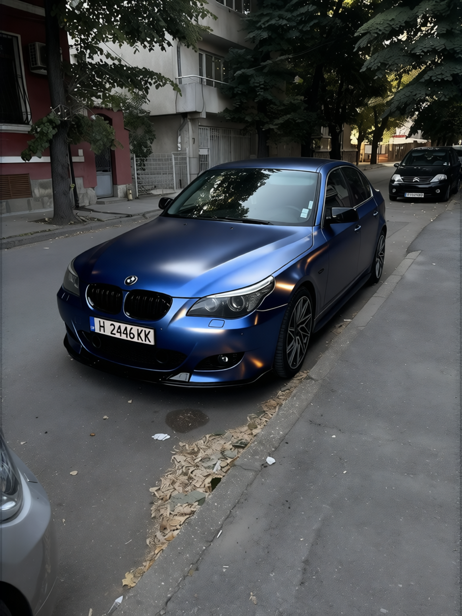 BMW 5 Series rendered in Frozen Satin Metallic Charcoal Blue gloss wrap