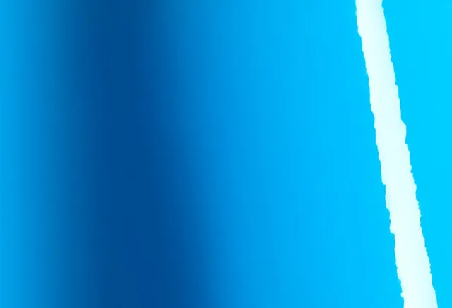 Avery Dennison Gloss Light Blue vinyl wrap film texture · Specced